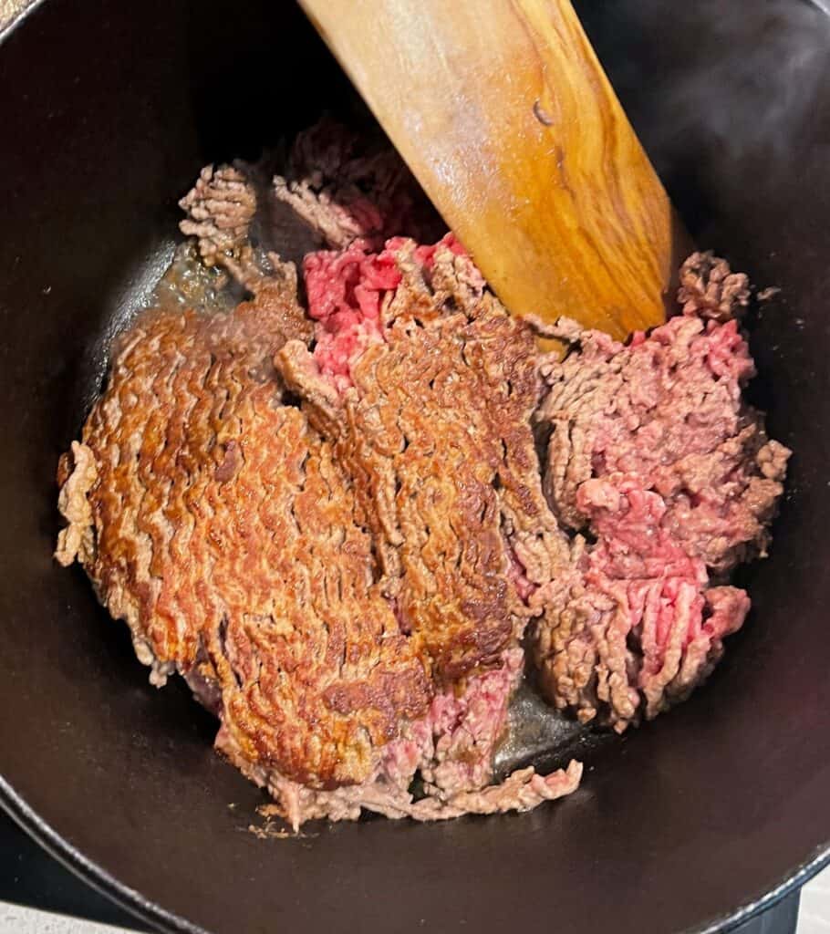 browned ground beef in a pot