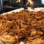 crispy instant pot carnitas on a baking sheet
