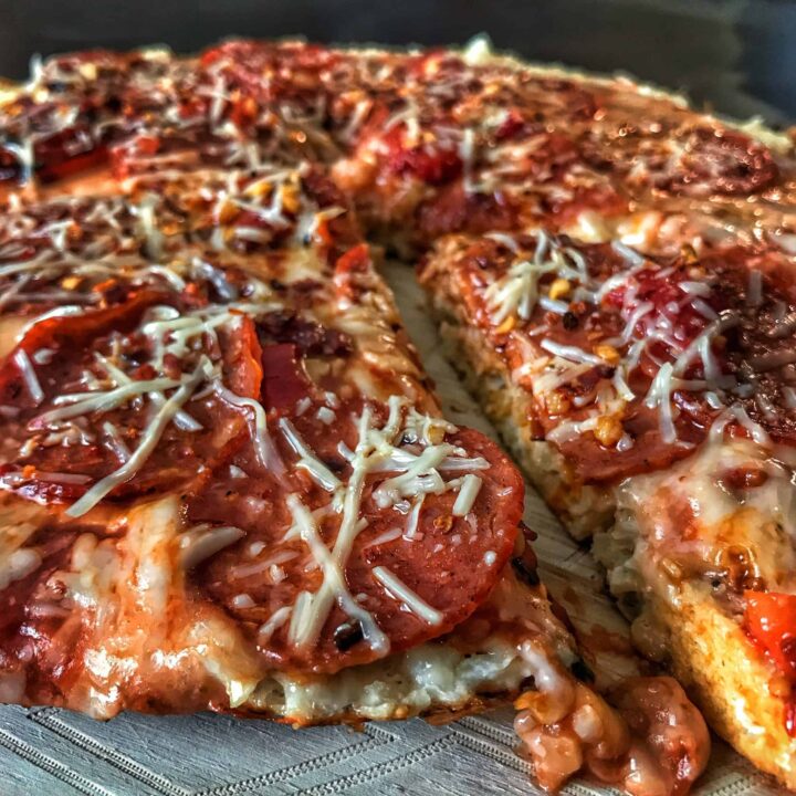 A high protein and low carb skillet pizza that's ready in 15 minutes on the stovetop. You can top it however you'd like, but the recipe creates a pizza with 90 calories and 12 grams of protein per slice!