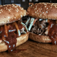 Pulled pork and BBQ sandwiches have never been easier or faster than now. This Instant Pot pulled pork recipe has four ingredients and unbelieve macros with roughly 16 grams of protein in a 136 calorie serving. This recipe is also crock pot friendly!
