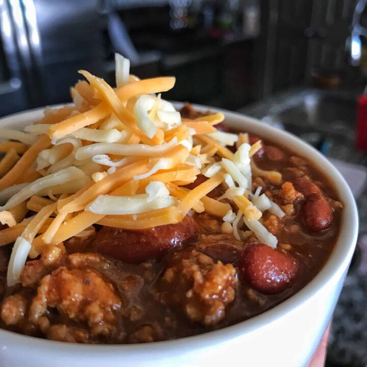 A ridiculously easy Instant Pot chili recipe that will save you a ton of time and energy while opening up a world of opportunity for other healthy recipes like low calorie Frito chili pie and high protein chili cheese tater tots and fries.