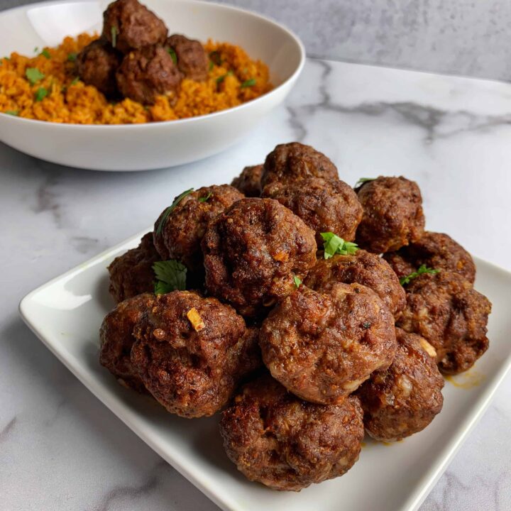 oven baked meatballs on a white plate
