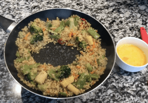 create a well for the egg in fried rice