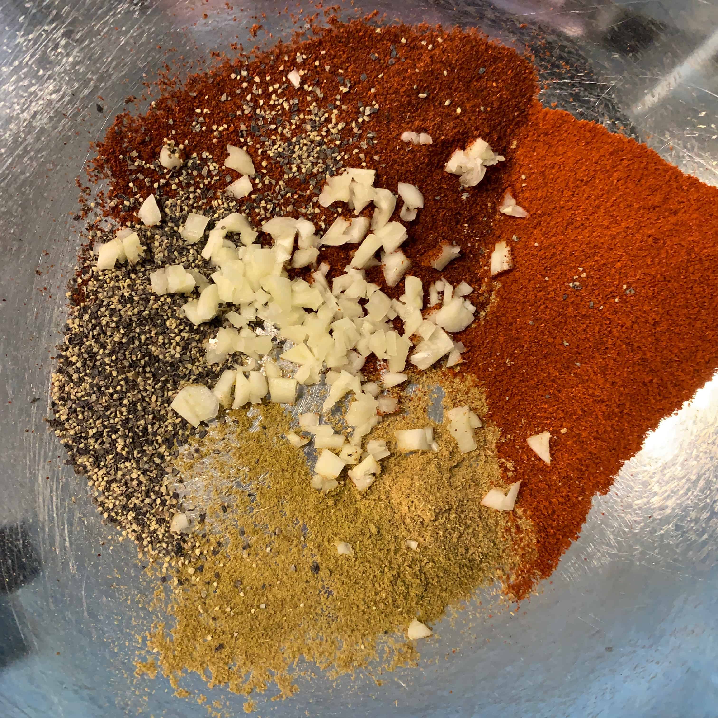 spices for chorizo meatballs in a bowl