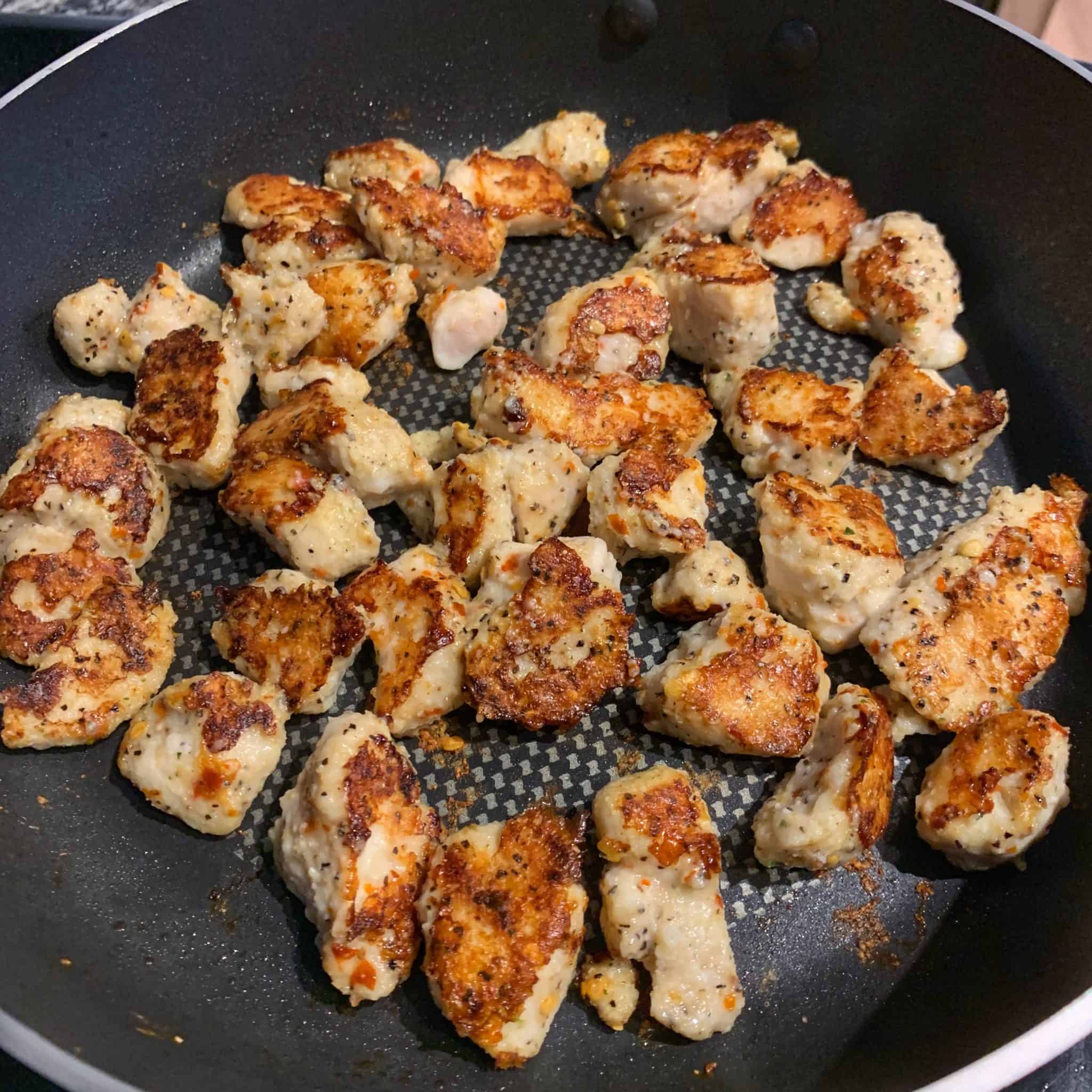 garlic parmesan chicken in the frying pan