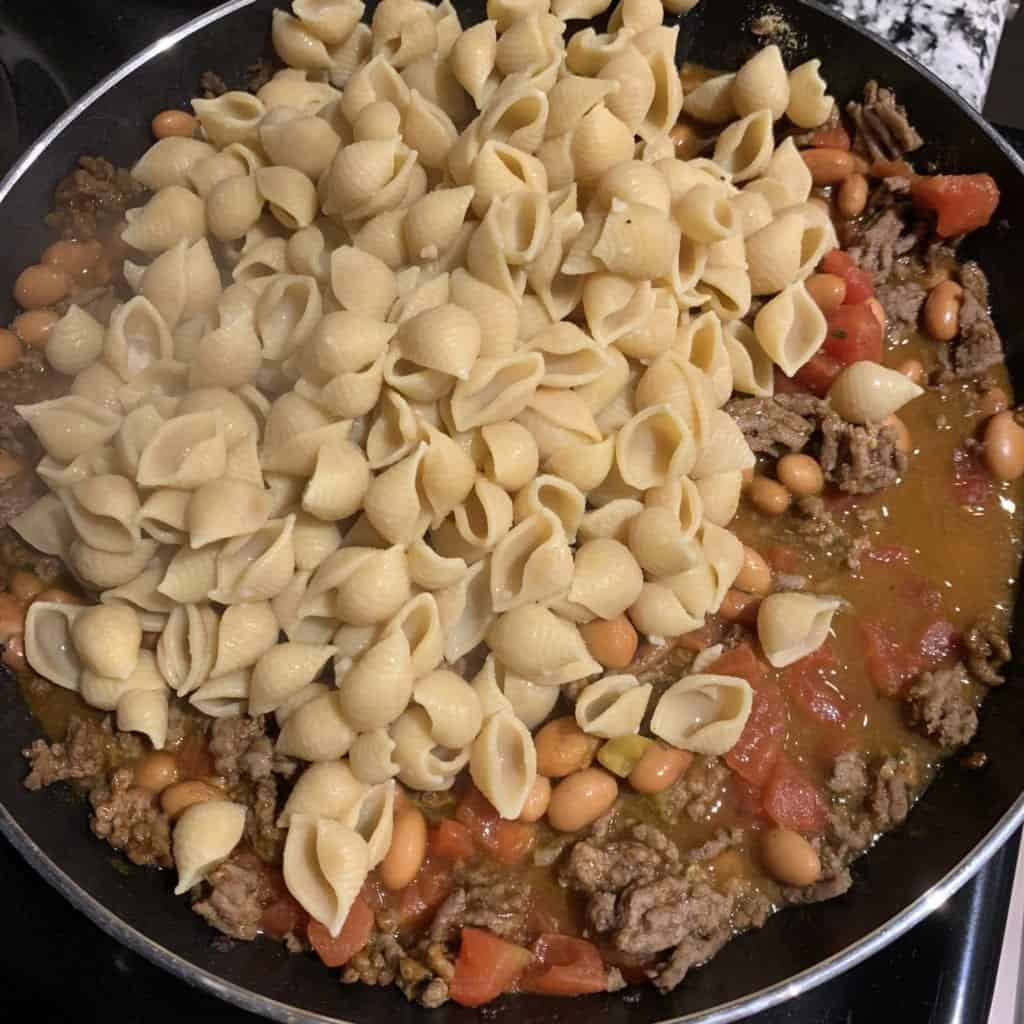 ground beef taco meat with pasta in a pan