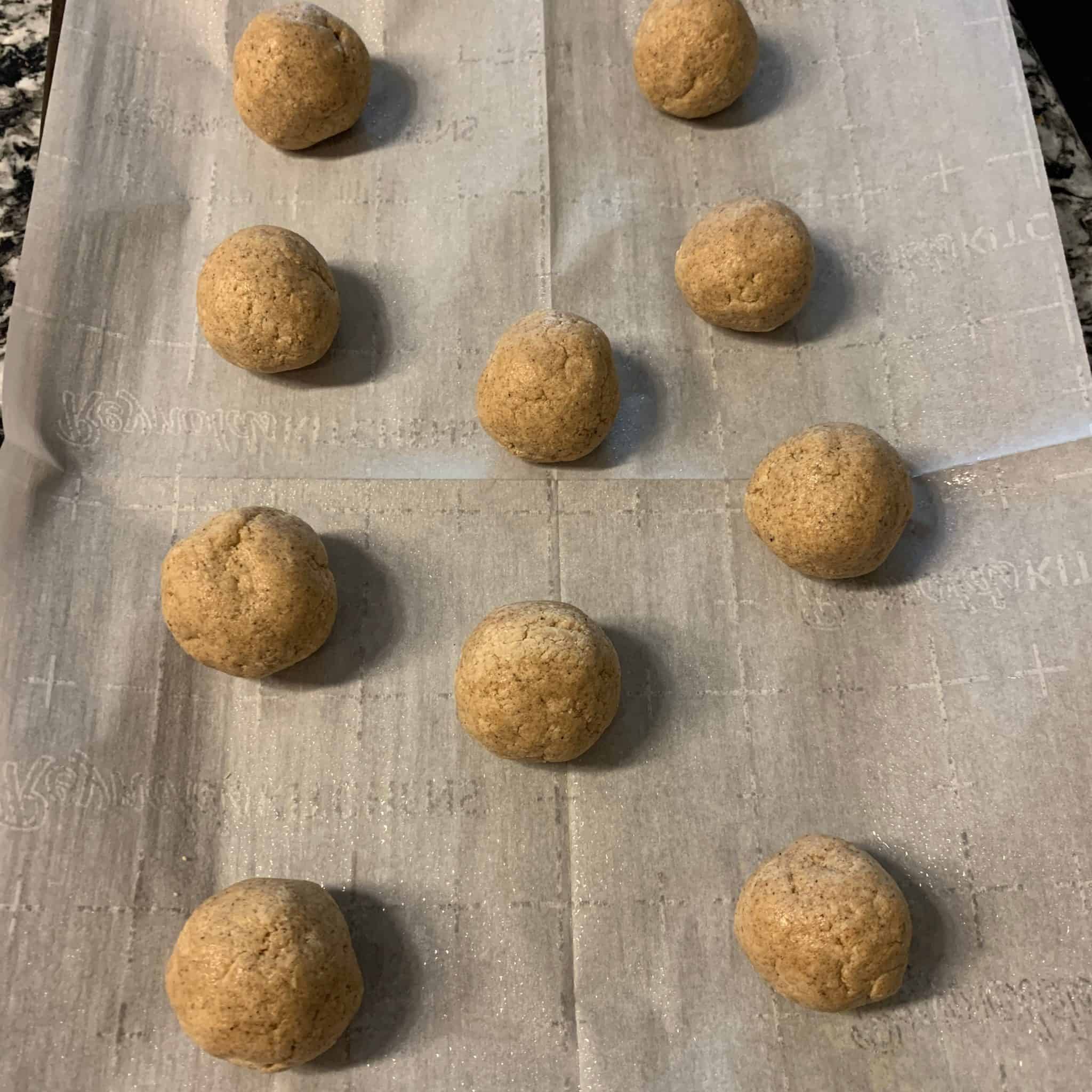 gingerbread protein balls before baking on the baking sheet
