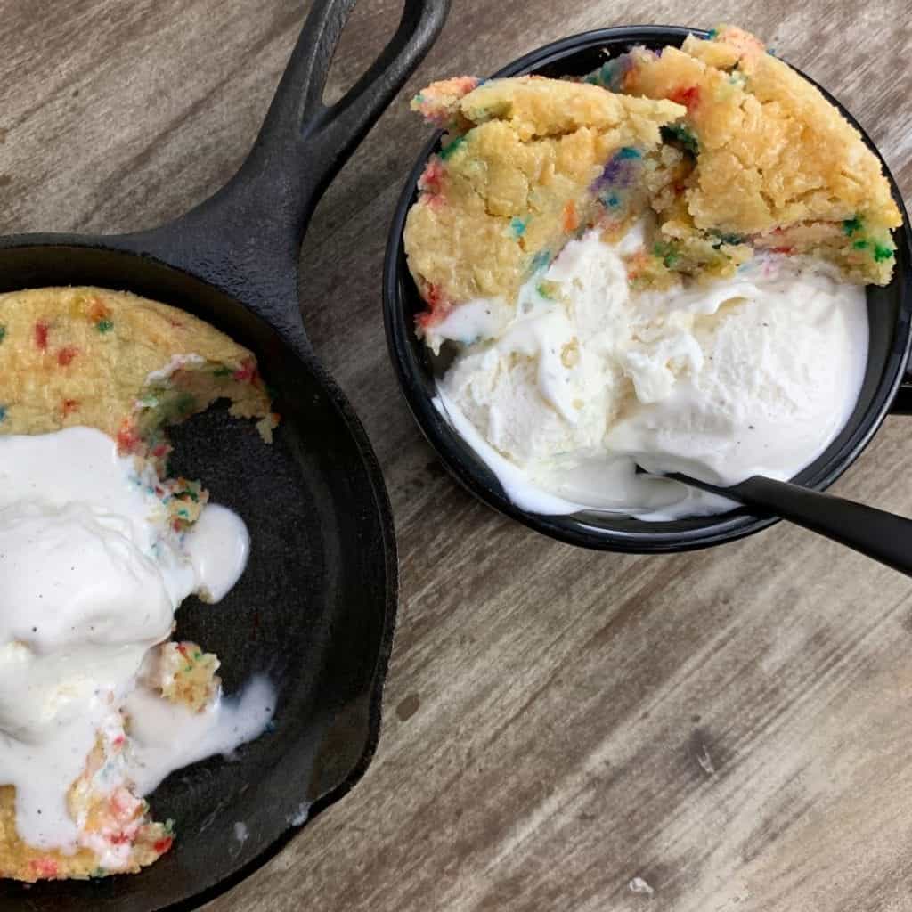 low carb skillet cookie in a mug with ice cream
