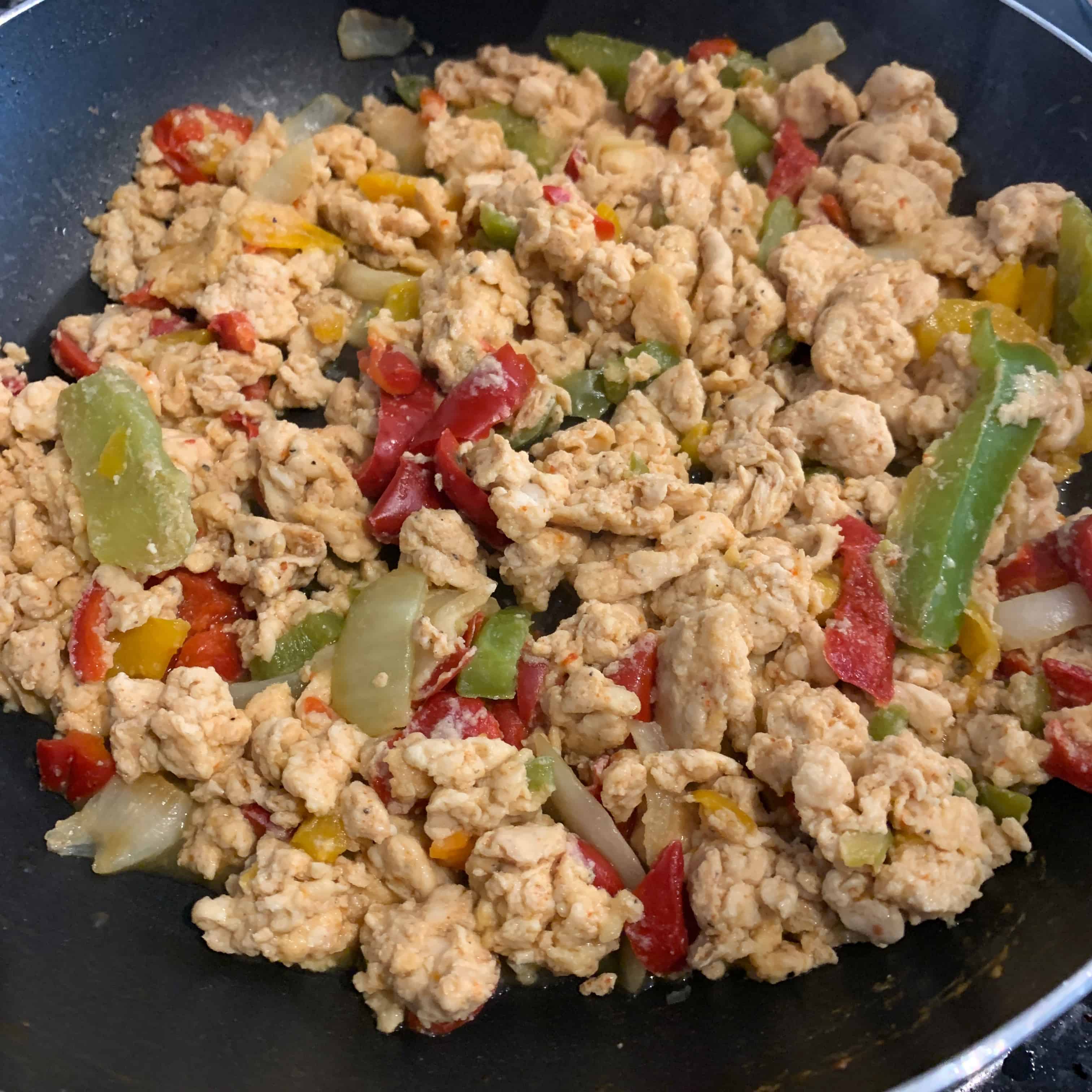 cooked egg whites with peppers in the skillet