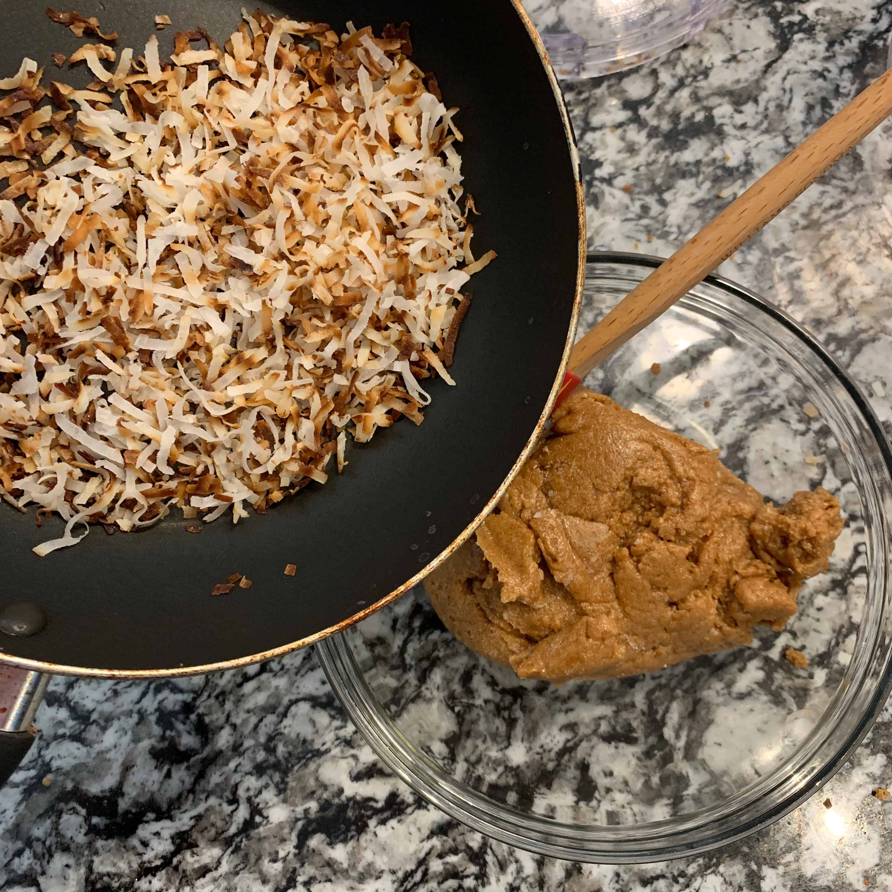 toasted coconut in a pan and the protein cookie butter in a bowl before combining the two