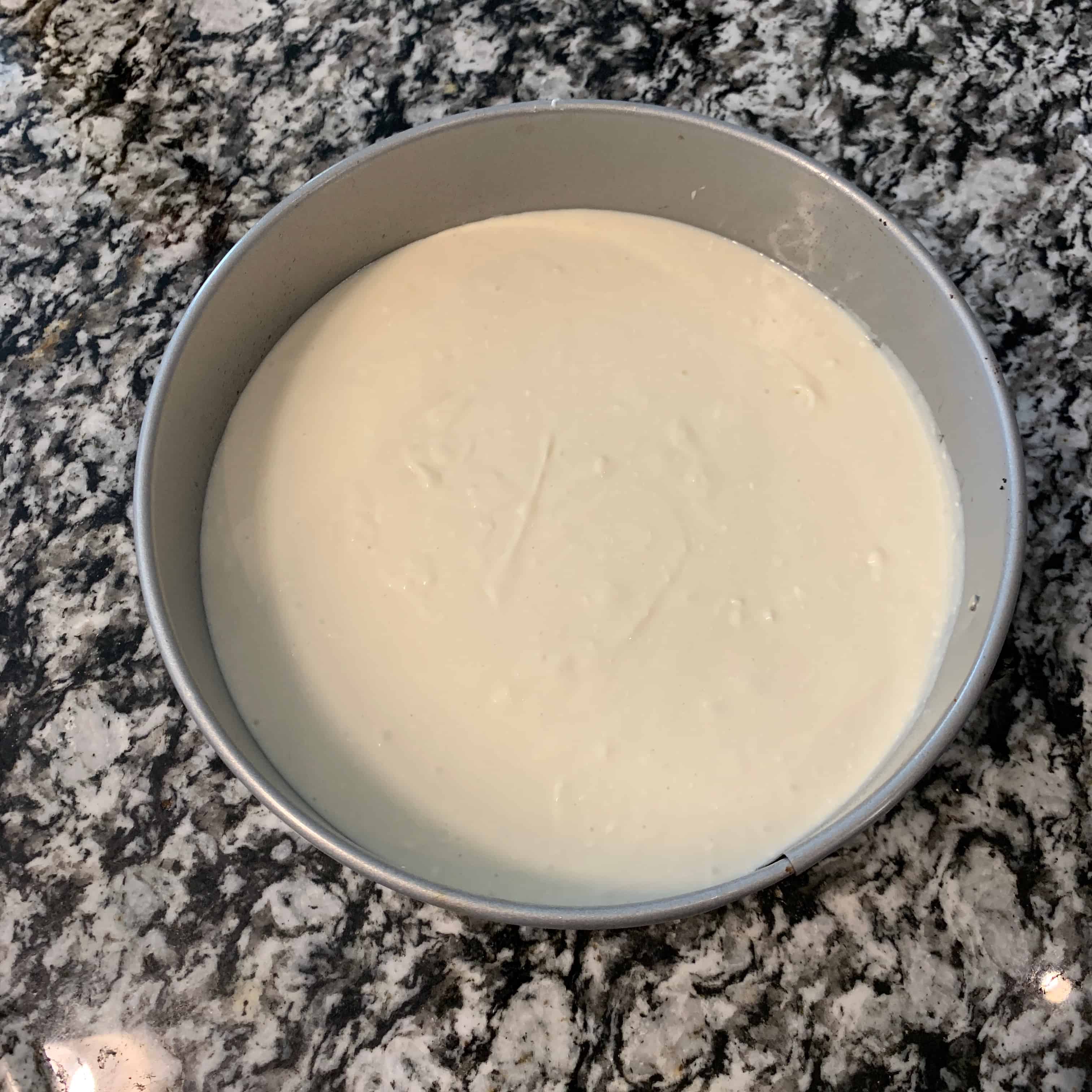 protein cheesecake mixture on top of the crust