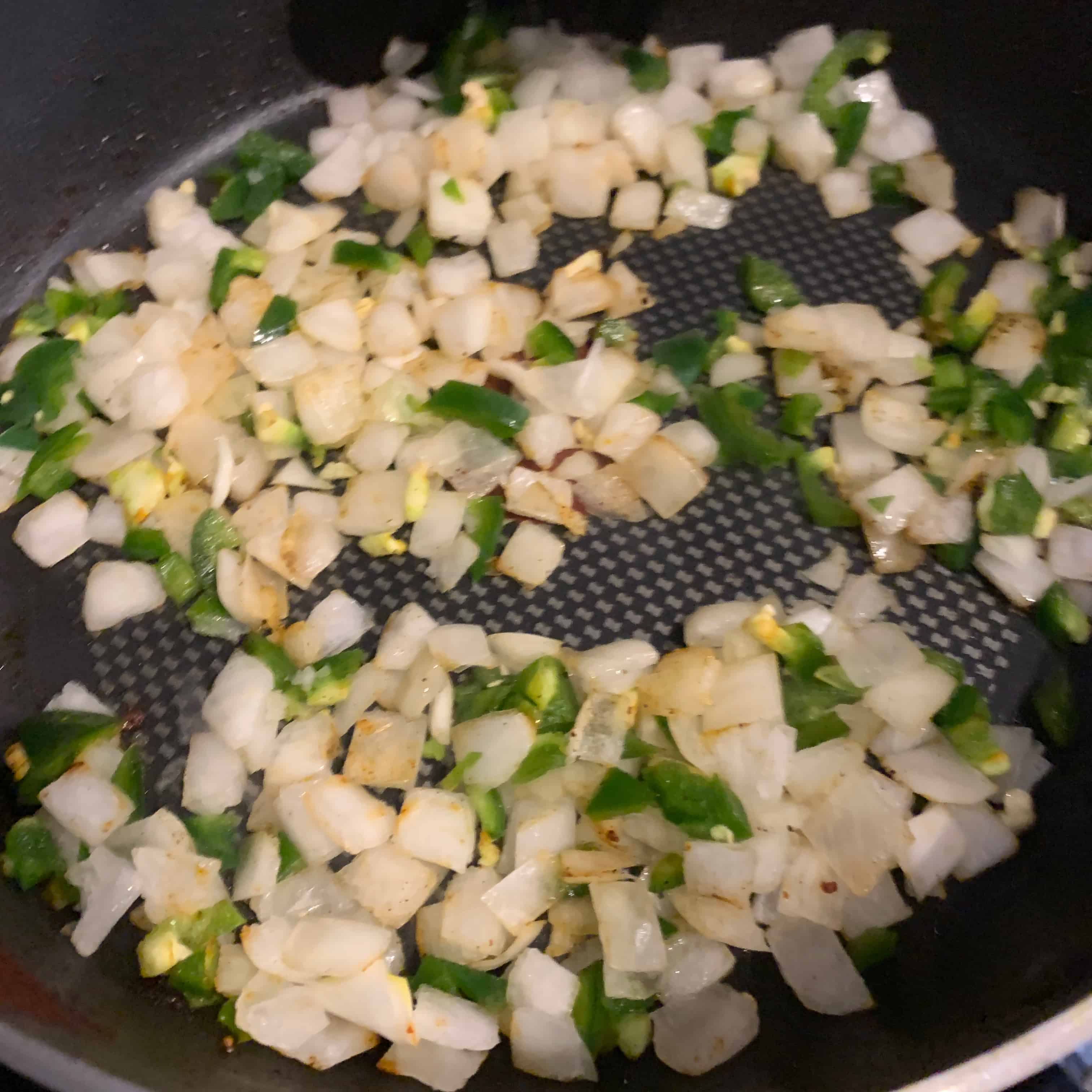 onion, jalapeño, and garlic in a skillet