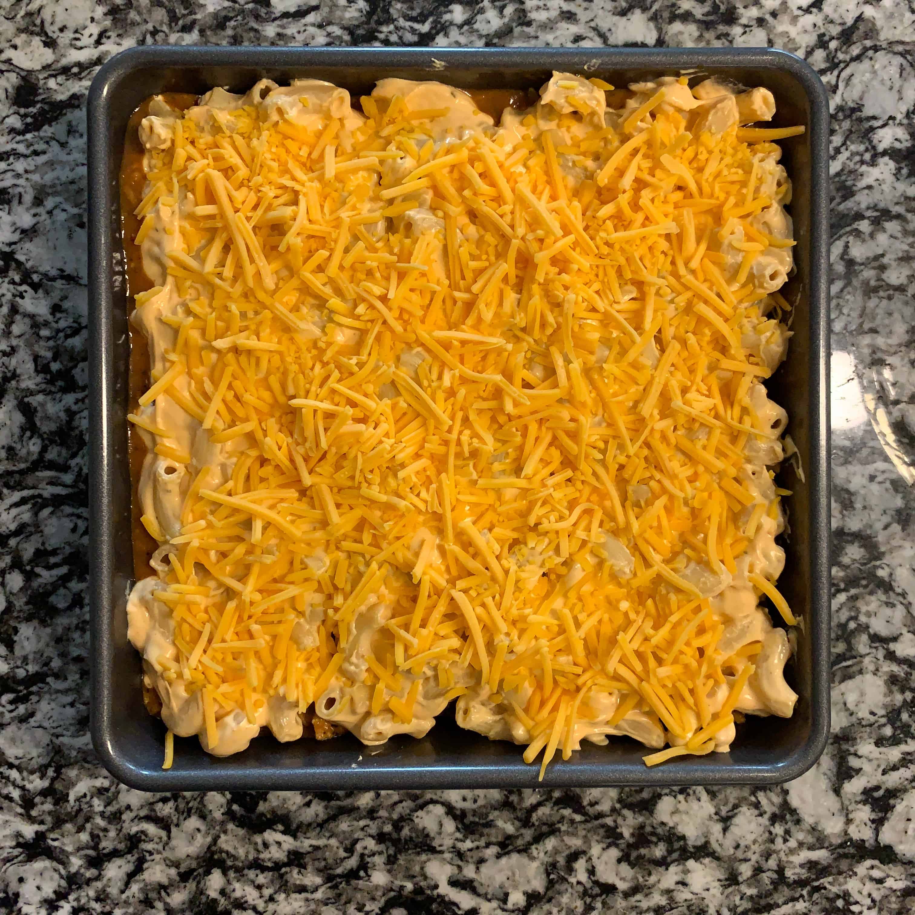 shredded cheddar on top of the low calorie mac and cheese bake