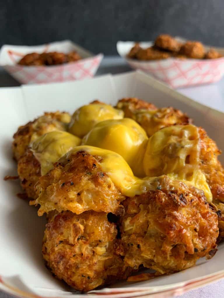 cauliflower tots in a paper tray