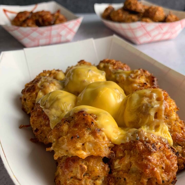 low carb cauliflower tots with melted cheese on top