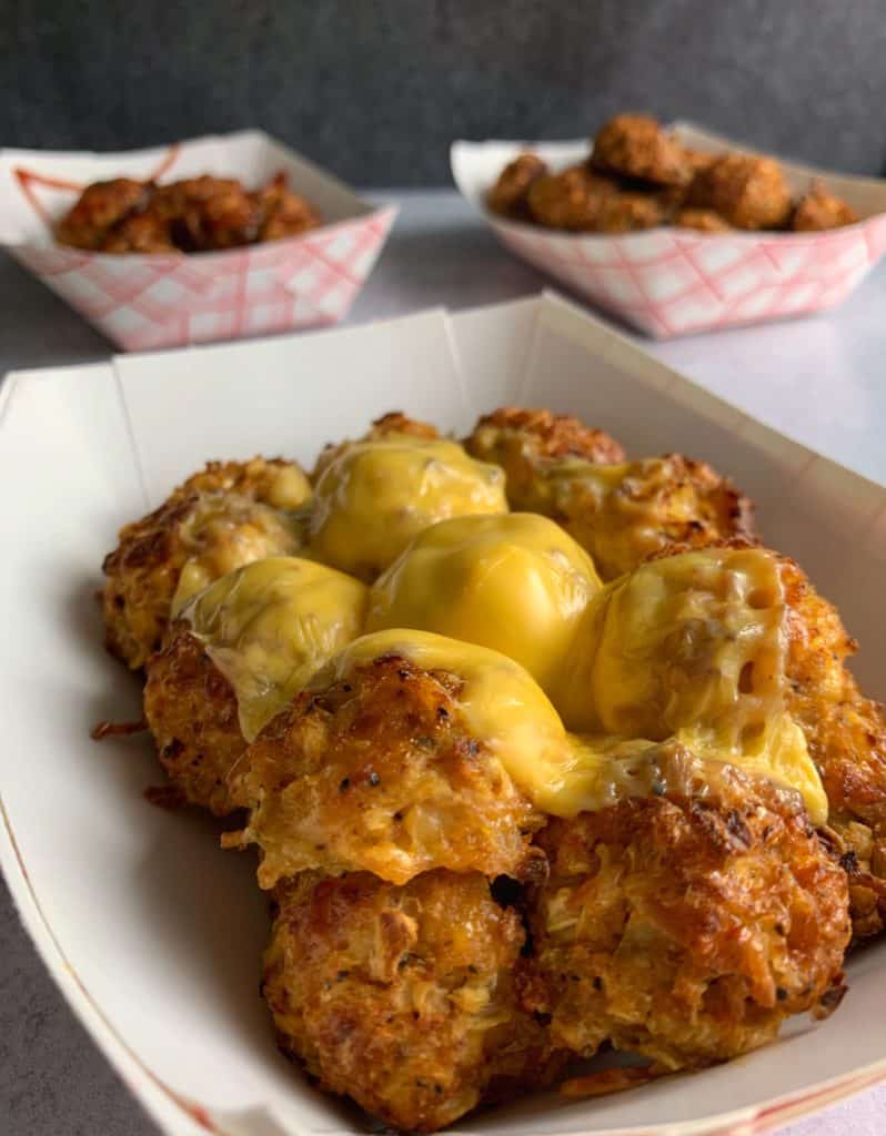 low carb cauliflower tots with melted cheese on top