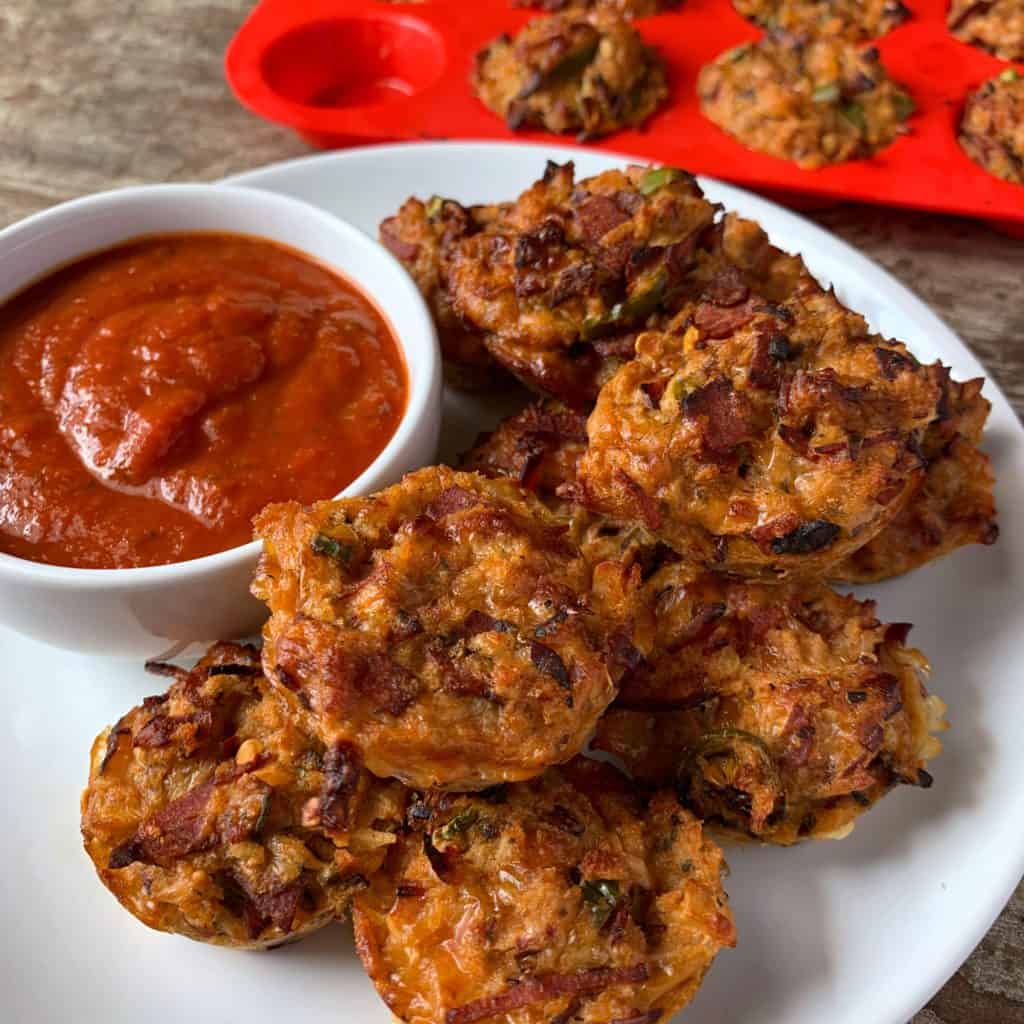 low carb pizza muffins on a white plate