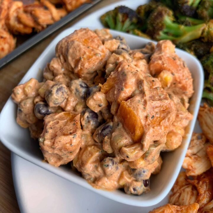 southwest sweet potato salad on a plate with honey chipotle chicken and broccoli
