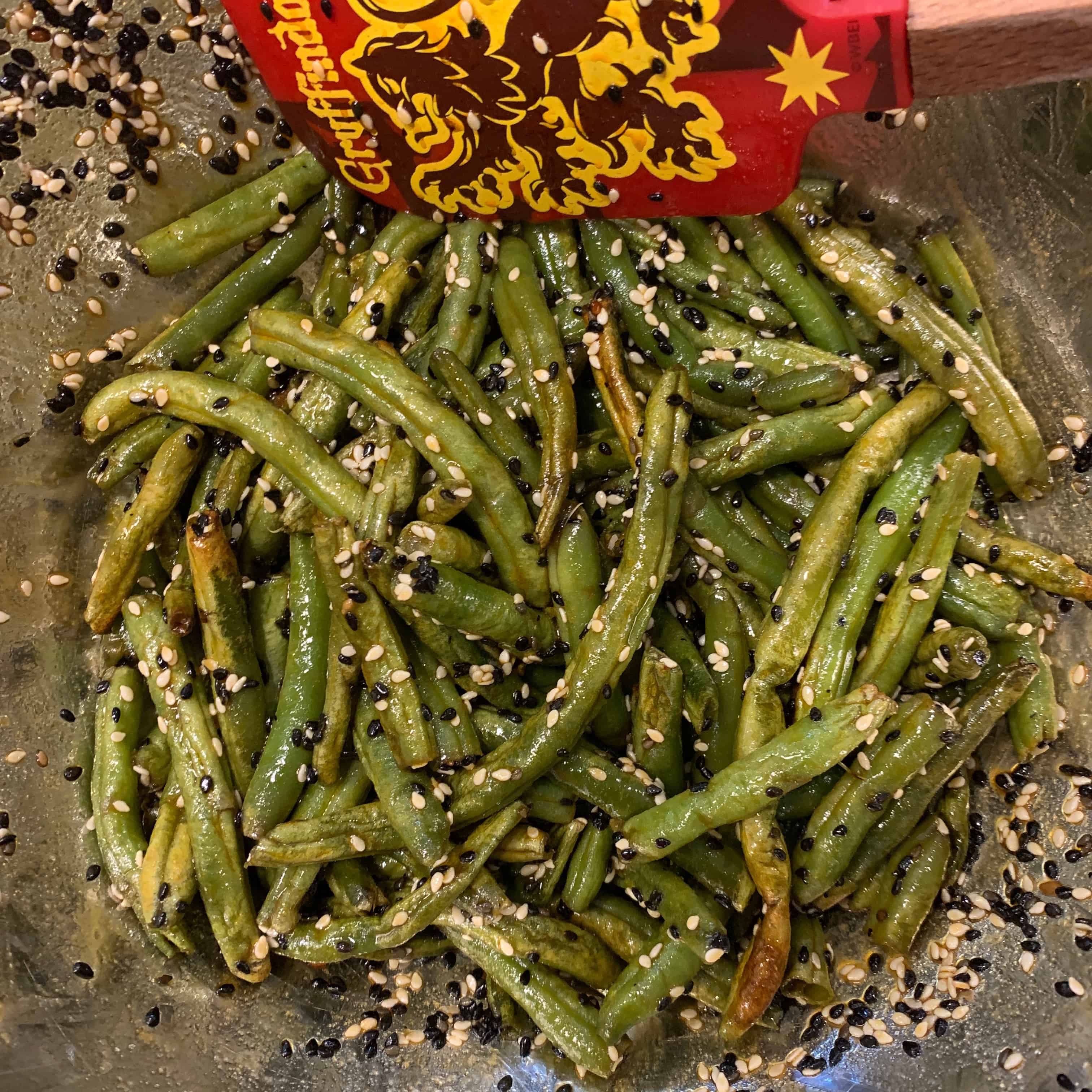 green beans tossed in the sesame seed and oil mixture