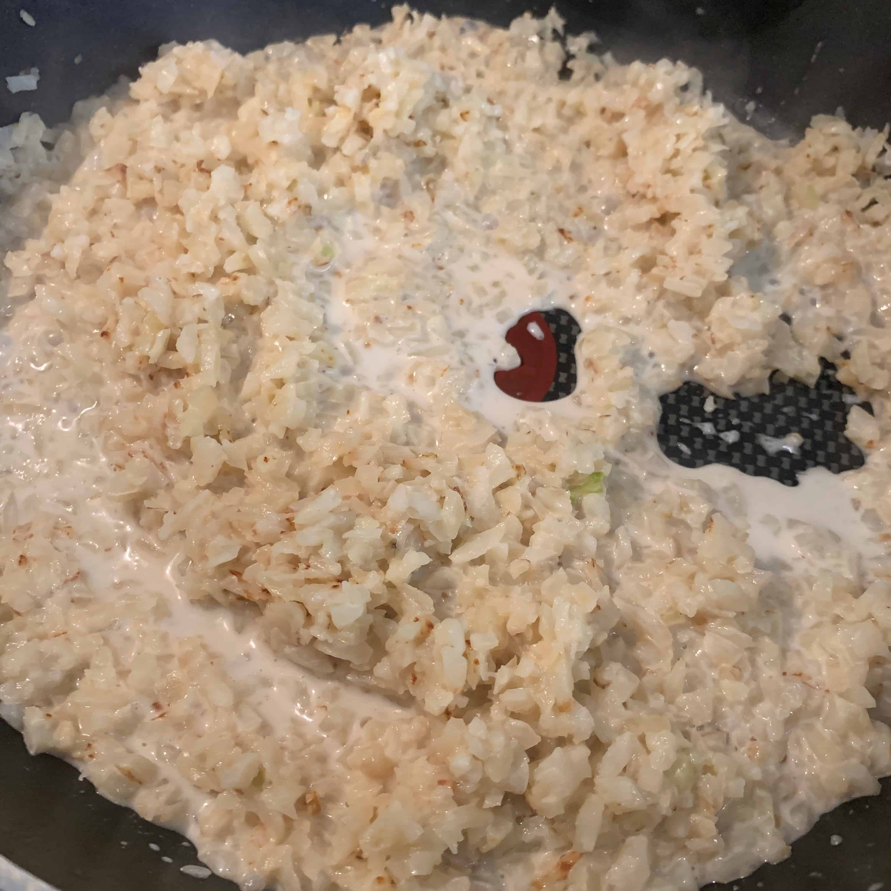 coconut milk in the pan fried coconut cauliflower rice