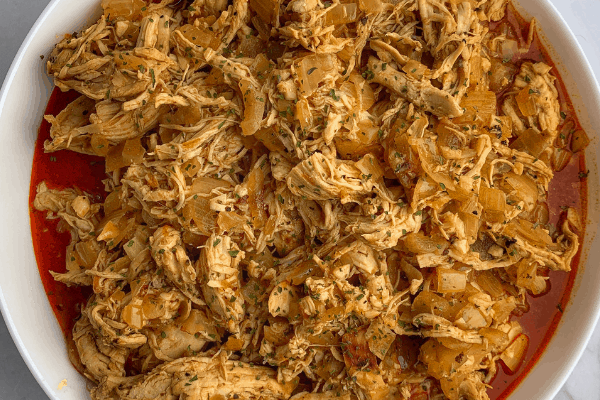 instant pot buffalo chicken in a white bowl