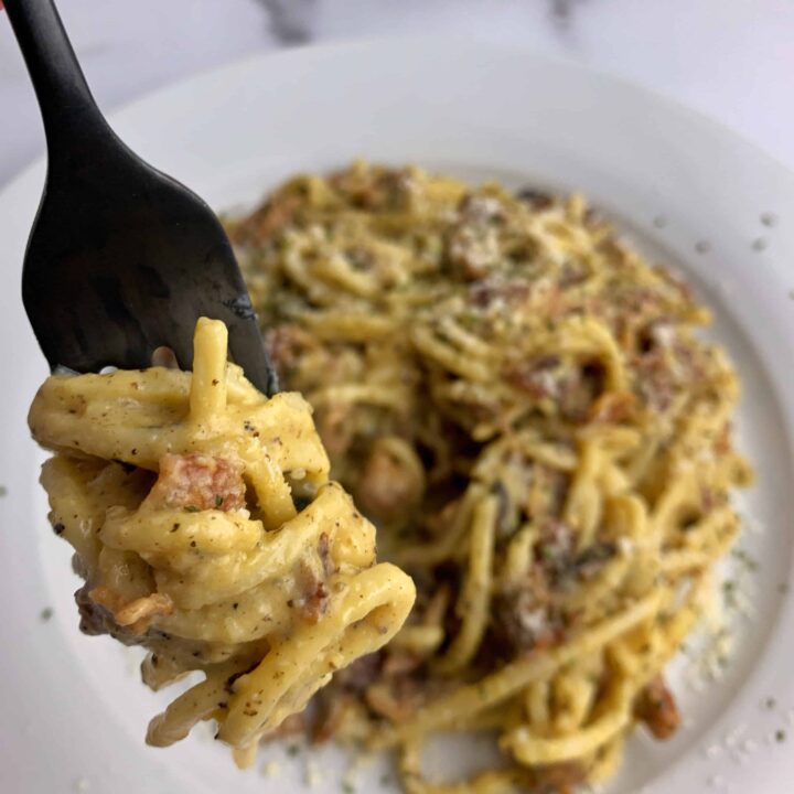 low carb pasta carbonara twirled on a fork