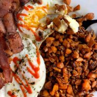 sweet potato hash browns with a fried egg and bacon