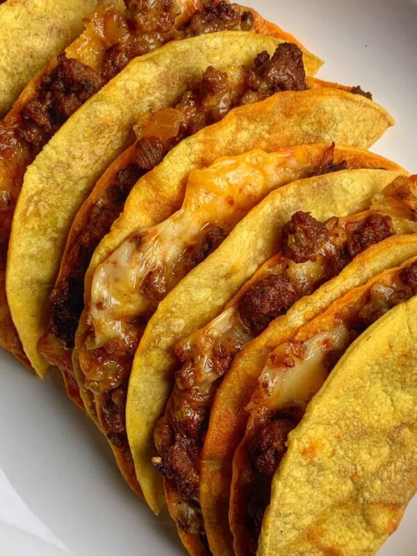 baked beef tacos on a white plate