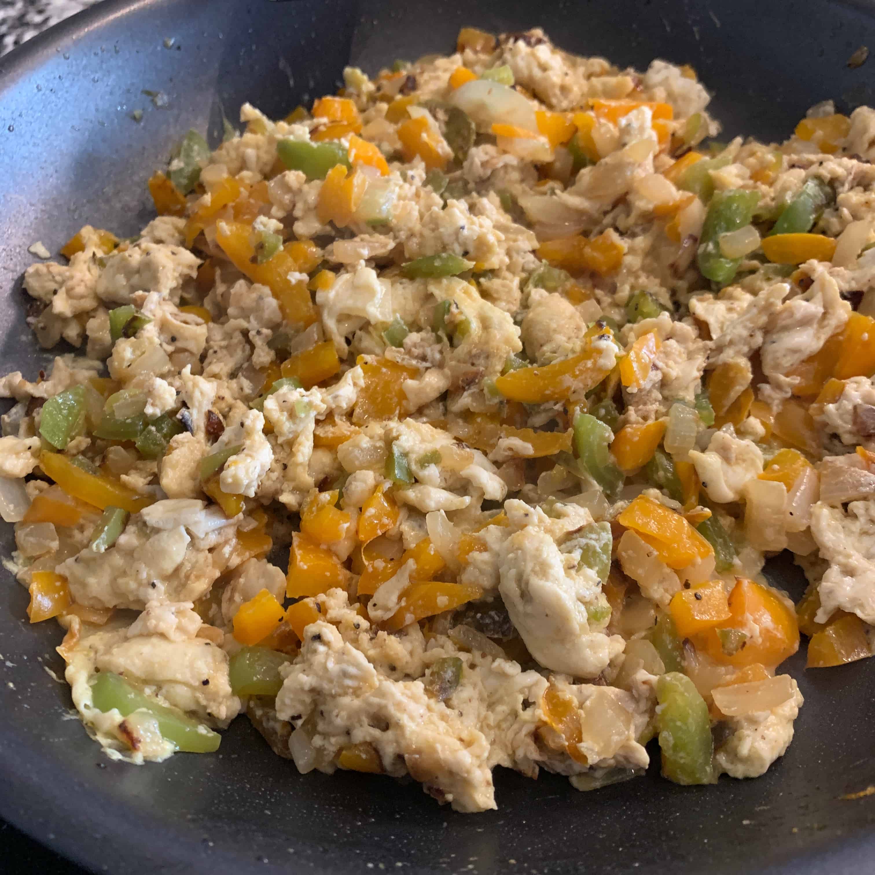 eggs scrambled with veggies for breakfast tacos
