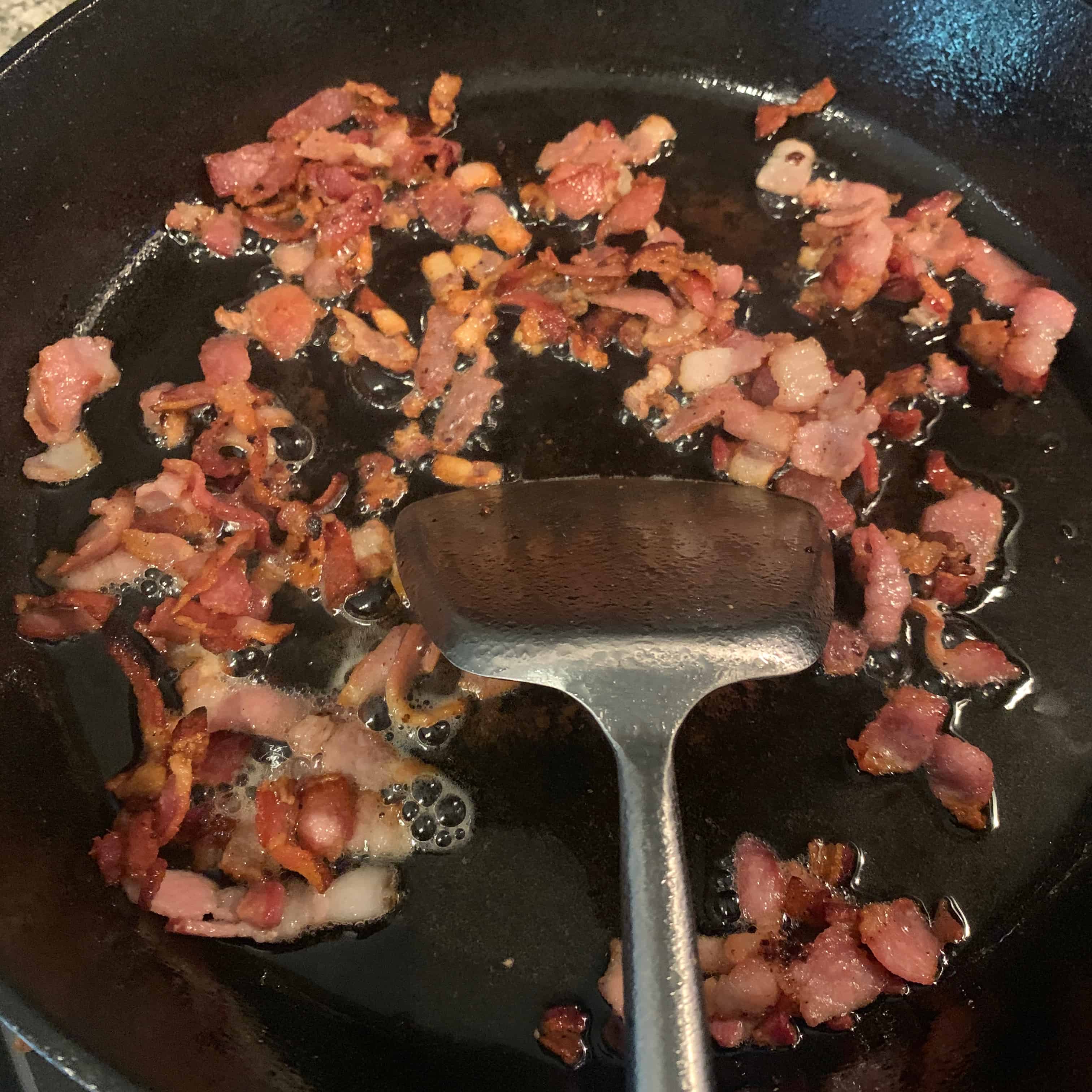 cooked bacon in cast iron skillet