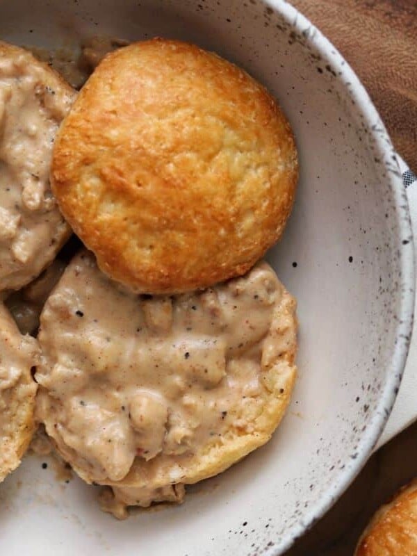 healthy sausage gravy on top of biscuits in a bowl