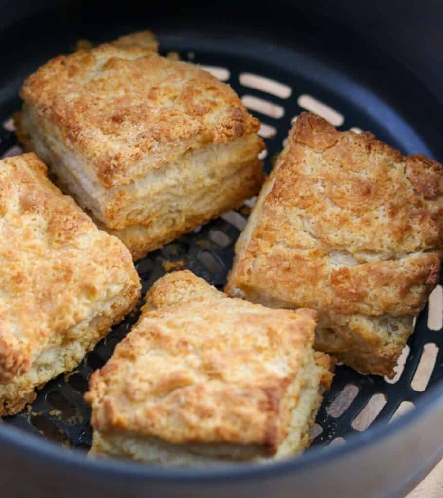 four biscuits in an air fryer basket