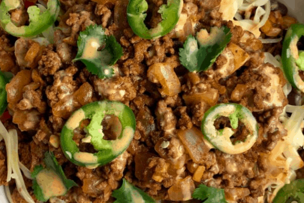taco meal prep bowls with sliced jalapeño and cilantro