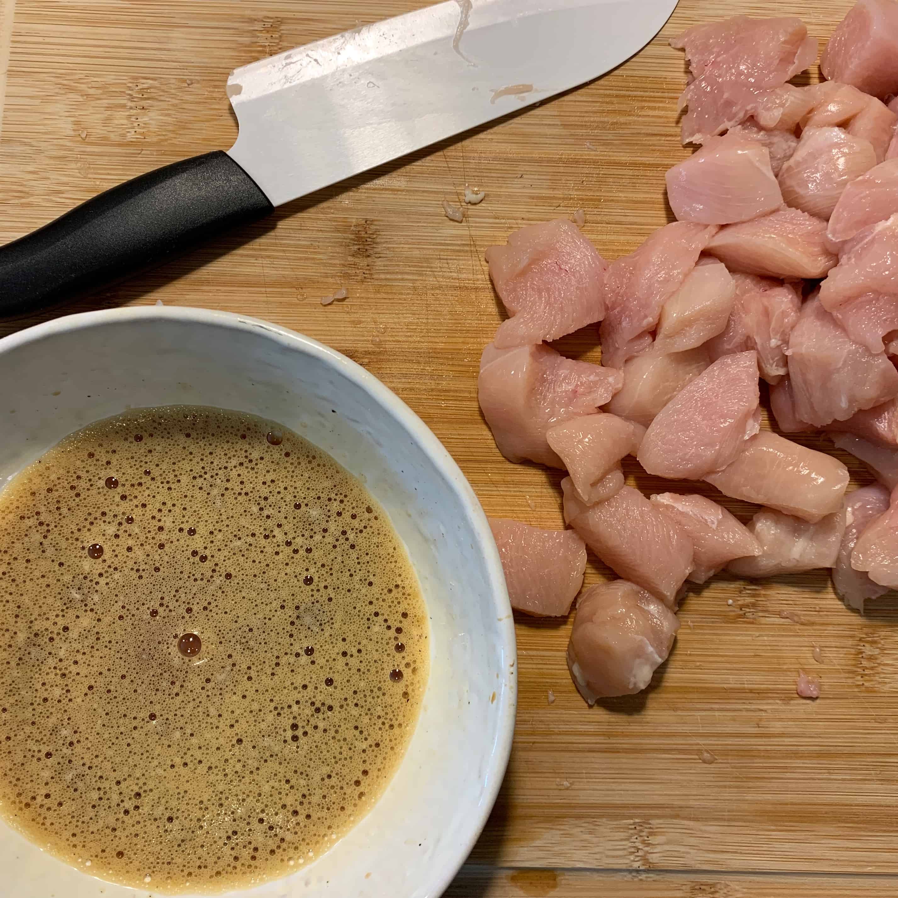chicken pieces and the egg, soy sauce, black pepper, and red wine vinegar marinade