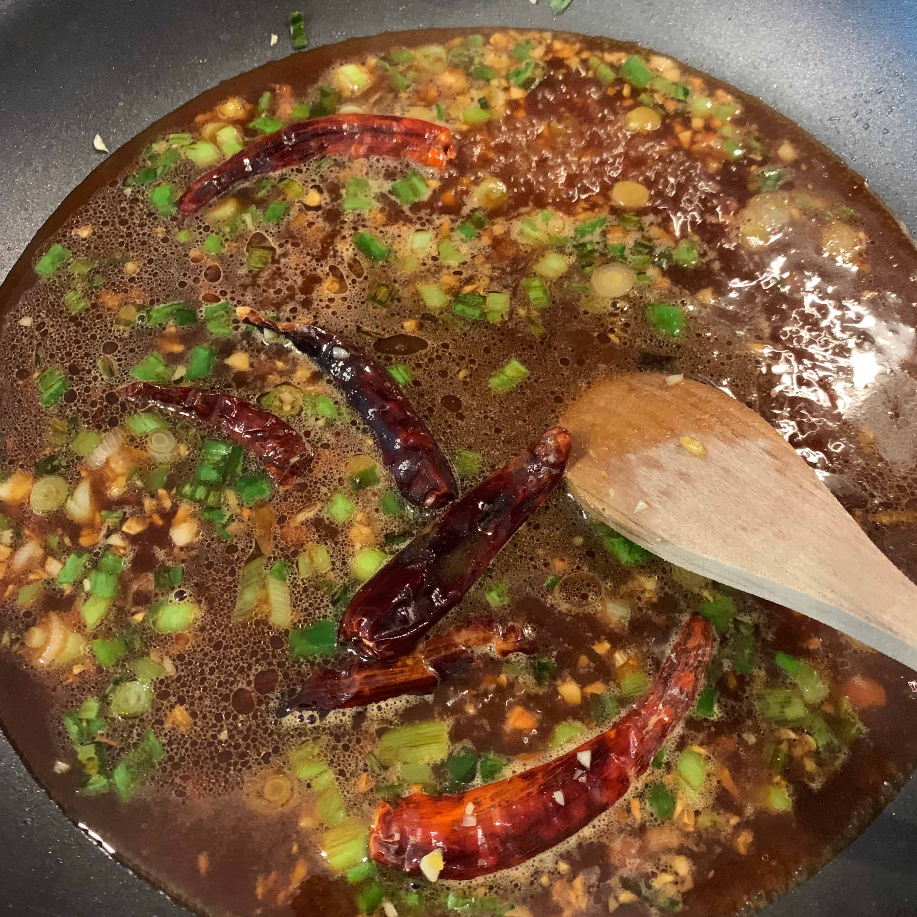 liquid general tso sauce ingredients added to skillet