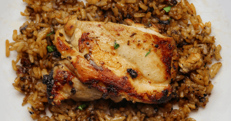 cilantro lime pan fried chicken thighs and rice on white plate