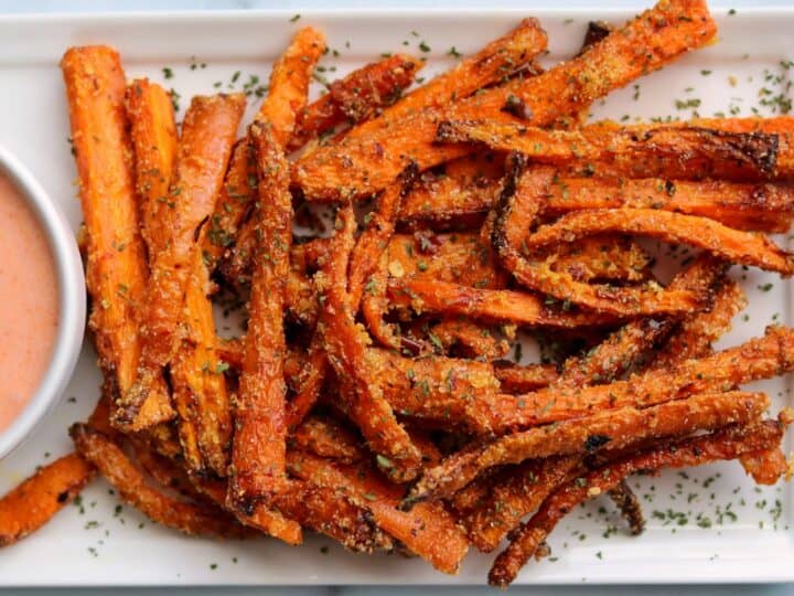 carrot fries on a white plate with dip