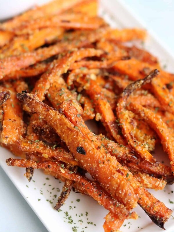 crispy air fried carrot fries on a white plate