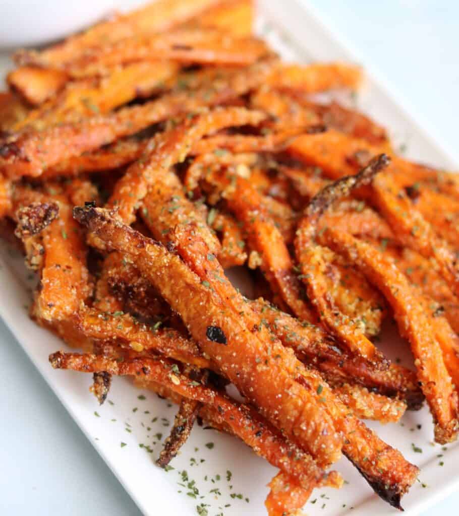 crispy air fried carrot fries on a white plate