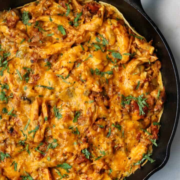 healthy king ranch chicken casserole in a cast iron skillet