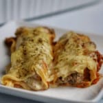 ricotta and beef cannelloni on a white plate