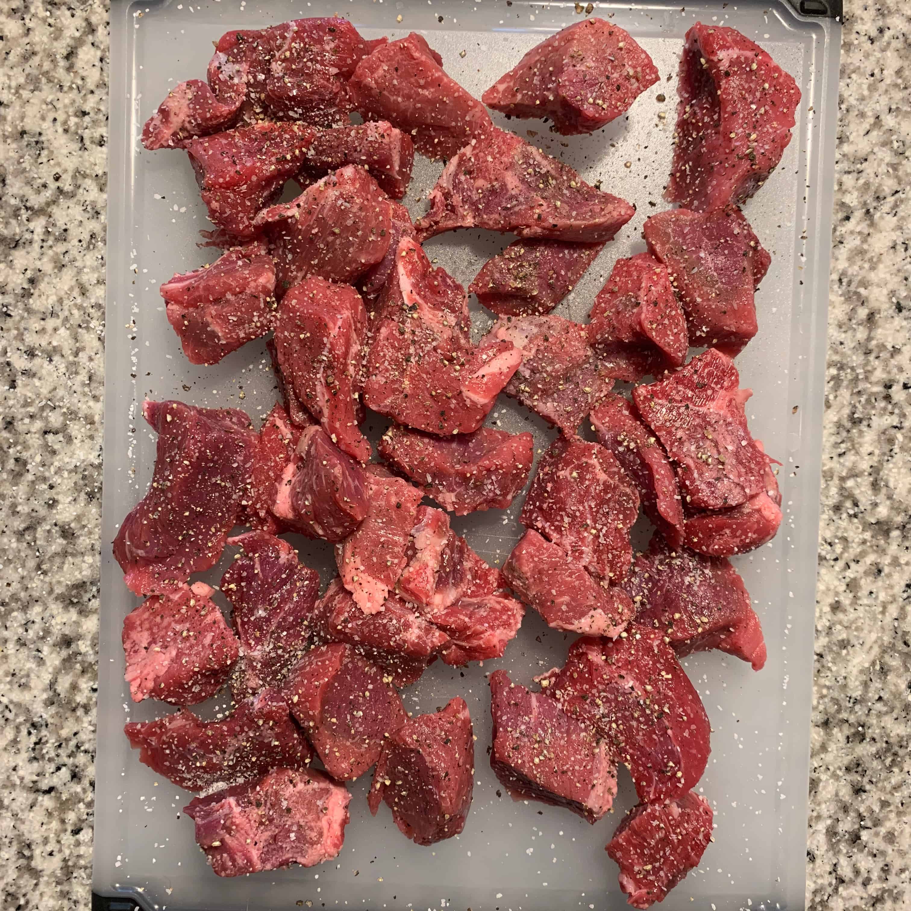 salt and pepper on the stew beef