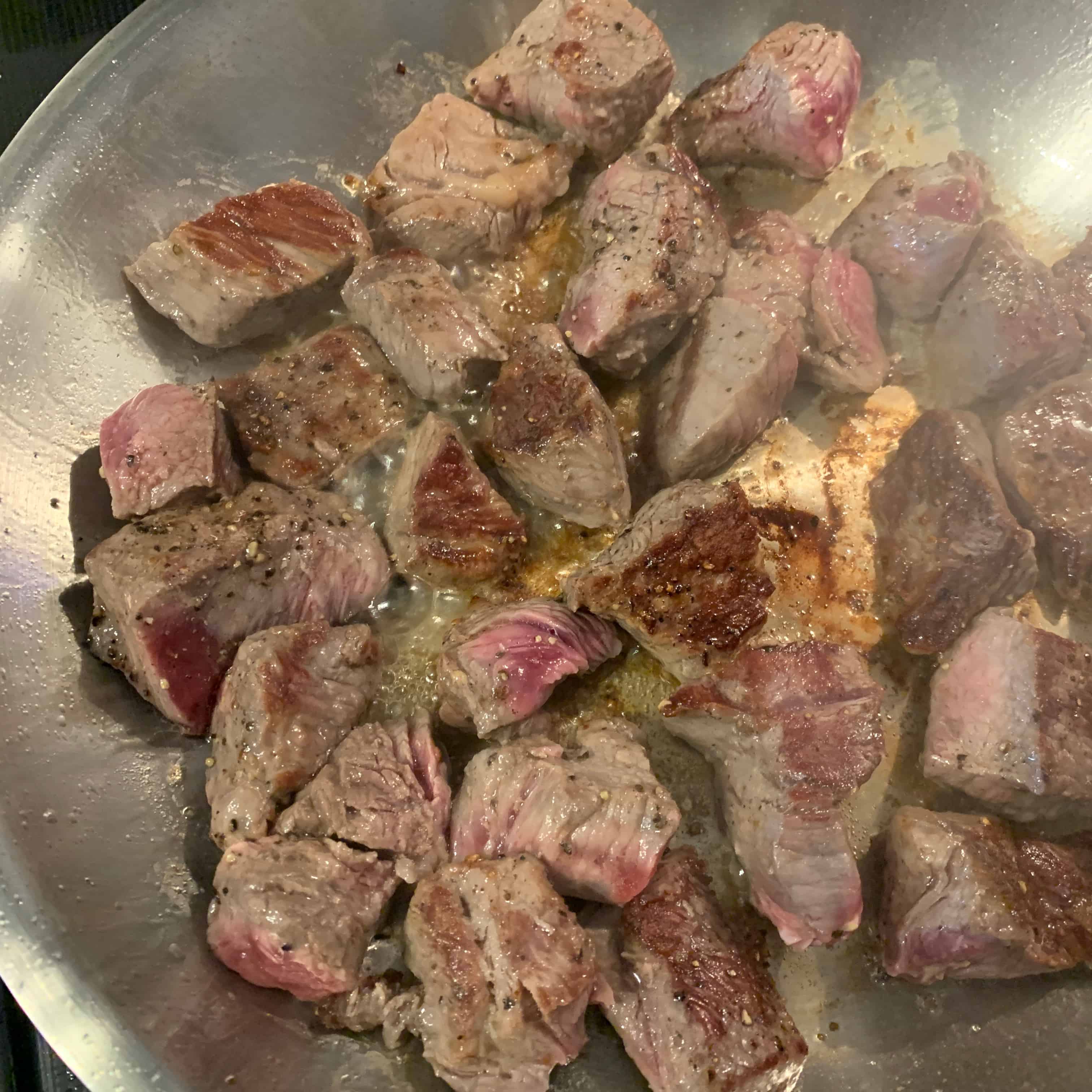 seared beef in a skillet