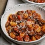 chicken sausage and mushroom cauliflower gnocchi in a stoneware bowl