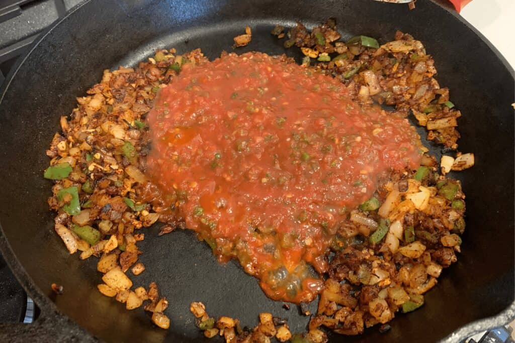 salsa added to the cooked onion, jalapeño, and garlic