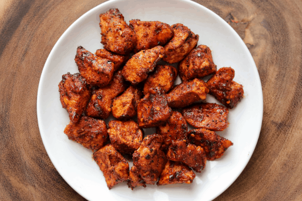 Nashville hot chicken nuggets on a white plate