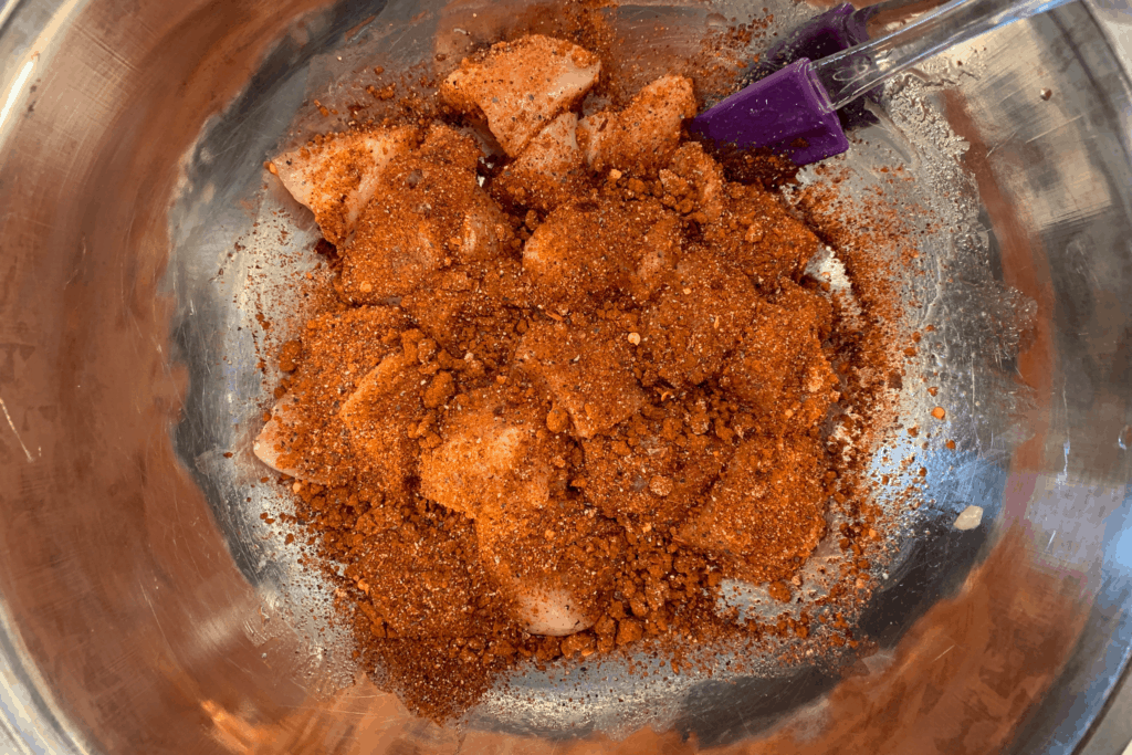 diced chicken breast covered in the Nashville hot spices