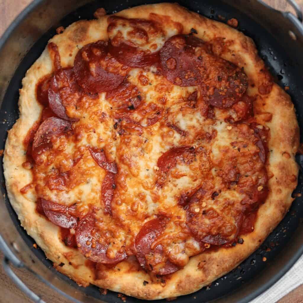 pepperoni pizza in the Ninja Foodi air fryer basket