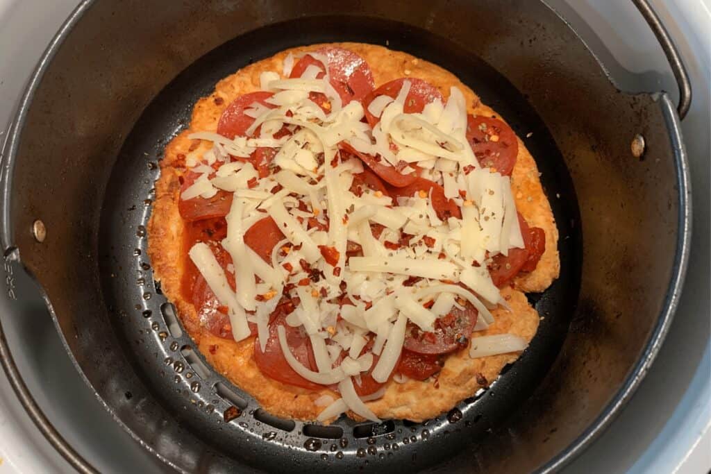toppings on the air fried pizza dough