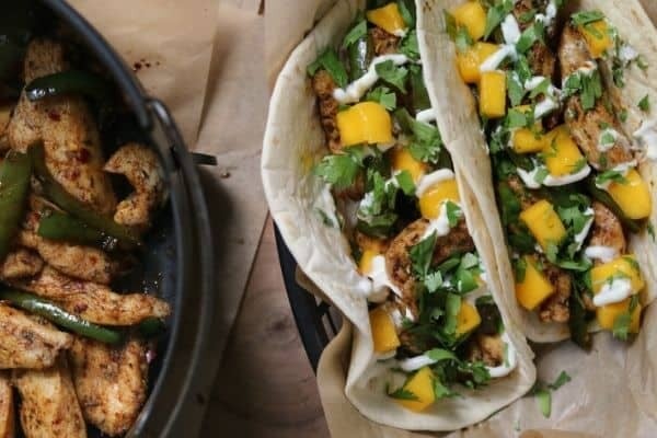 two Torchy's brushfire tacos next to an air fryer basket